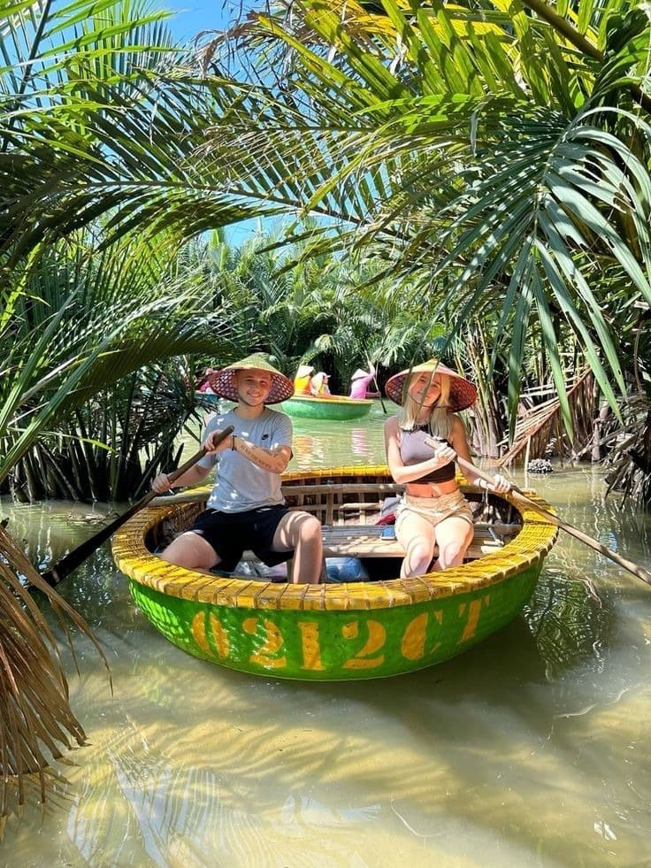 Travellers exploring palm-lined waterways by basket boat