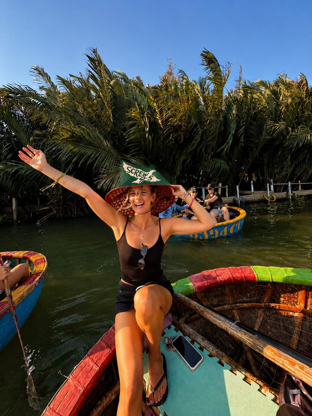 Traveller waving from a colourful basket boat