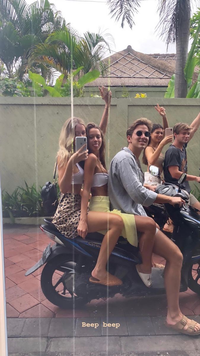 Friends riding scooters together